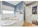 Spa-like bathroom with a garden tub and walk-in closet at 4113 Barret Ave, Plant City, FL 33566