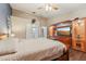 Bright bedroom featuring a large bed and entertainment center at 4113 Barret Ave, Plant City, FL 33566