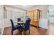 Cozy dining area with glass table and four blue chairs at 4113 Barret Ave, Plant City, FL 33566