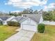Light blue house with a two-car garage at 4113 Barret Ave, Plant City, FL 33566