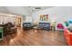 Spacious living room with hardwood floors, and leather furniture at 4113 Barret Ave, Plant City, FL 33566