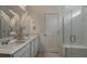 Bathroom with double vanity, large shower, and modern finishes at 4176 Feldspar Ln, Spring Hill, FL 34609