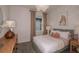 Bright bedroom with a comfortable bed and neutral decor at 4176 Feldspar Ln, Spring Hill, FL 34609