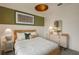 Well-lit bedroom with a stylish bed and modern nightstands at 4176 Feldspar Ln, Spring Hill, FL 34609