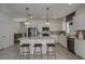 Modern kitchen with white cabinets, island, and stainless steel appliances at 4176 Feldspar Ln, Spring Hill, FL 34609