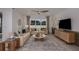 Spacious living room with a neutral color palette and large windows at 4176 Feldspar Ln, Spring Hill, FL 34609