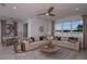 Open living room with large windows and comfortable seating at 4176 Feldspar Ln, Spring Hill, FL 34609