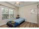 Bright bedroom with light blue bedding and ceiling fan at 4207 S Dale Mabry Hwy # 12210, Tampa, FL 33611