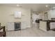 Small kitchenette with white cabinets and wine cooler at 4207 S Dale Mabry Hwy # 12210, Tampa, FL 33611