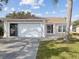 Two-car garage and light-colored exterior at 4303 Waltham Ln, New Port Richey, FL 34653