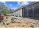 Landscaped backyard pathway leads to a screened enclosure at 4825 Scott Rd, Lutz, FL 33558