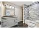 Bathroom features a walk-in shower, granite vanity, and built-in shelving at 4825 Scott Rd, Lutz, FL 33558
