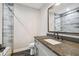 Bathroom boasts a walk-in shower and granite countertop at 4825 Scott Rd, Lutz, FL 33558