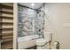Updated bathroom with a walk-in shower and built-in shelving at 4825 Scott Rd, Lutz, FL 33558