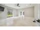 Main bedroom with tile floors, sliding doors, and backyard views at 4825 Scott Rd, Lutz, FL 33558