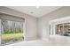Bright bonus room with large windows and access to the outdoor kitchen at 4825 Scott Rd, Lutz, FL 33558