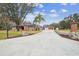 House exterior with a long driveway and landscaping at 4825 Scott Rd, Lutz, FL 33558