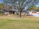 House exterior showcasing a walkway and landscaping at 4825 Scott Rd, Lutz, FL 33558