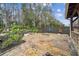 Relaxing firepit area with flagstone patio and landscaping at 4825 Scott Rd, Lutz, FL 33558