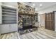 Stone fireplace with built-in shelving and barn door at 4825 Scott Rd, Lutz, FL 33558