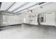 Large garage with overhead storage and built-in cabinets at 4825 Scott Rd, Lutz, FL 33558