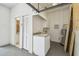 Garage with utility sink, storage, and laundry hookups at 4825 Scott Rd, Lutz, FL 33558