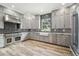 Modern kitchen with stainless steel appliances and farmhouse sink at 4825 Scott Rd, Lutz, FL 33558