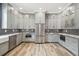 Modern kitchen with gray cabinets, granite countertops and stainless steel appliances at 4825 Scott Rd, Lutz, FL 33558