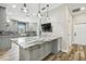 Kitchen island with granite countertop and modern pendant lighting at 4825 Scott Rd, Lutz, FL 33558