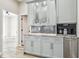Built-in coffee bar with granite countertop and gray cabinets at 4825 Scott Rd, Lutz, FL 33558