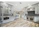 Modern kitchen with stainless steel appliances and gray cabinets at 4825 Scott Rd, Lutz, FL 33558