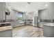 Modern kitchen with gray cabinets, granite countertops and stainless steel appliances at 4825 Scott Rd, Lutz, FL 33558