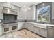 Spacious kitchen featuring stainless steel appliances and a farmhouse sink at 4825 Scott Rd, Lutz, FL 33558