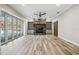 Spacious living area featuring a stone fireplace and built-in shelving at 4825 Scott Rd, Lutz, FL 33558