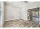 Bright office with wood-look floors, opens to living area at 4825 Scott Rd, Lutz, FL 33558