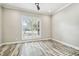 Sunlit home office with plantation shutters and wood-look tile floors at 4825 Scott Rd, Lutz, FL 33558
