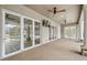 Covered patio with pool view and access from multiple sliding doors at 4825 Scott Rd, Lutz, FL 33558