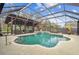 Inviting pool area with a covered patio and outdoor kitchen at 4825 Scott Rd, Lutz, FL 33558