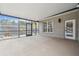 Bright screened porch with additional access to the backyard at 4825 Scott Rd, Lutz, FL 33558