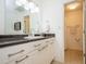 Clean bathroom with white vanity and granite countertop at 5005 Coquina Key Se Dr # E, St Petersburg, FL 33705