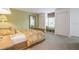 Bedroom with window seat, double closets and carpet at 5005 Coquina Key Se Dr # E, St Petersburg, FL 33705