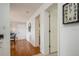 Hallway with wood floors and access to other rooms at 5005 Coquina Key Se Dr # E, St Petersburg, FL 33705