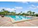 Inviting community pool with surrounding patio at 5005 Coquina Key Se Dr # E, St Petersburg, FL 33705