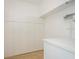 White storage closet with ample shelving at 5005 Coquina Key Se Dr # E, St Petersburg, FL 33705