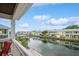 Stunning waterfront view of canal with boats and charming buildings at 5005 Coquina Key Se Dr # E, St Petersburg, FL 33705