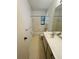 Clean bathroom with a bathtub, toilet, and vanity at 5106 W Evelyn Dr, Tampa, FL 33609