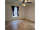 Bright bedroom with tile flooring and ceiling fan at 604 8Th Sw St, Ruskin, FL 33570