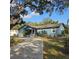 Cute ranch home with a long driveway and tropical landscaping at 604 8Th Sw St, Ruskin, FL 33570