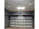 Garage with overhead storage and two ceiling fans at 604 8Th Sw St, Ruskin, FL 33570