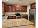 Spacious kitchen with granite countertops and stainless steel appliances at 604 8Th Sw St, Ruskin, FL 33570